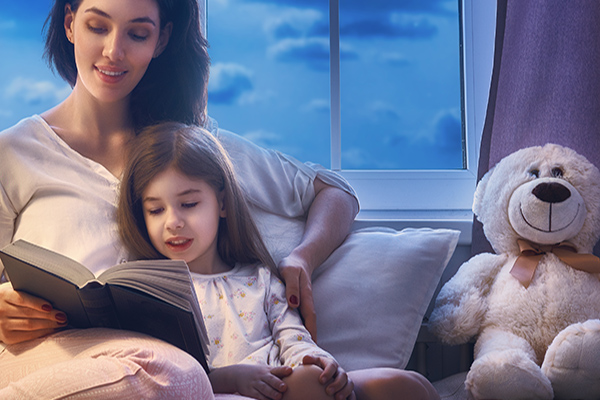 Family,Reading,Bedtime.,Pretty,Young,Mother,Reading,A,Book,To