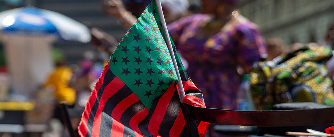 Black,Liberation,African,American,Flag.,Blurred,Background
