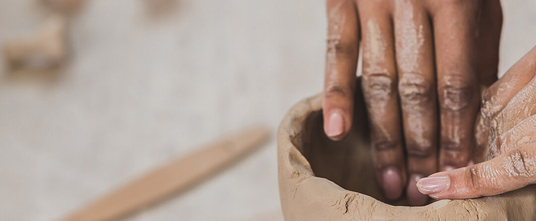 Partial,View,Of,Young,African,American,Woman,Sculpting,Clay,Pot